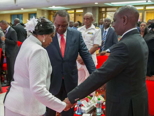 President Uhuru Kenyatta and Deputy President William Ruto during a church service in Karen on Sunday. / COURTESY