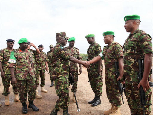 The Kenyan Defense Forces Army Commander Lt. General Leonard Ngondi is welcomed by Kenyan troops serving under the African Union Mission in Somalia (AMISOM), in Kismayo, Somalia on Saturday.Photo/COURTESY