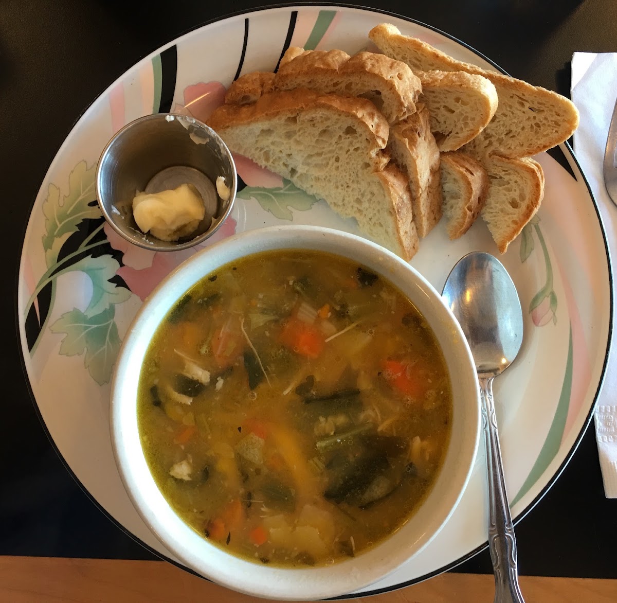 Bowl of Chicken and Rice Soup with gluten free sourdough bread. No longer serving sourdough.
