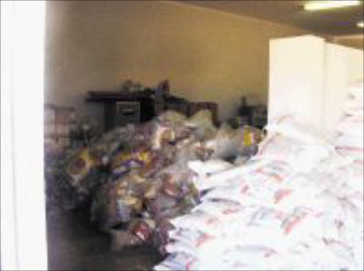 WHAT A WASTE: Tons of food parcels, meant for distribution to the needy, lie stacked in government warehouses in Botlokwa, Limpopo. PIC: MOYAHABO MABEBA. Circa Sep 2009. © Sowetan