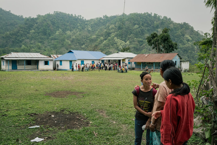 Villagers get together next to a polling station on the first polling day on April 19, 2024 in Alipurduar District, West-Bengal, India. Picture: ELKE SCHOLIERS/GETTY IMAGES