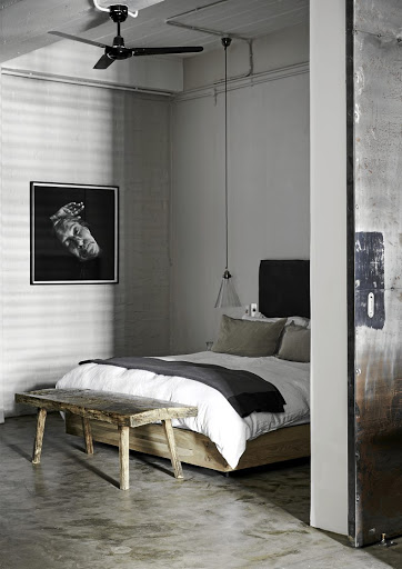 The bedroom is beyond a custom-made galvanised steel door; it feaures a bespoke dressing room and an ensuite.