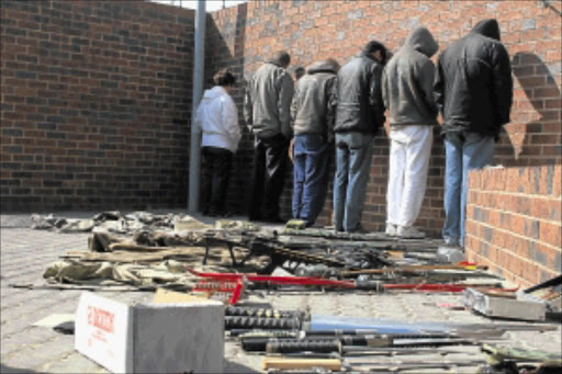 MORNING SWOOP: Police officers confiscated an assortment of arms in Primrose, Germiston, on Friday. PHOTO: BAFANA MAHLANGU