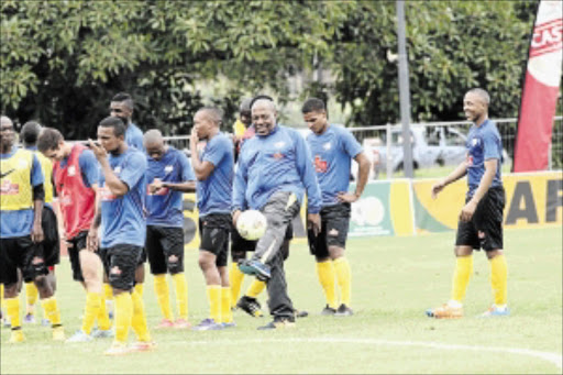 RELAXED : Bafana Bafana coach Shakes Mashaba with his charges during a training session at People's Park in Durban on Tuesday Photo: Veli Nhlapo