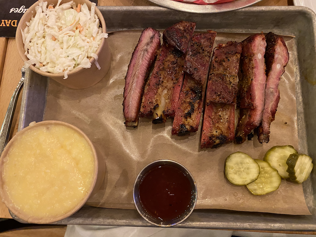 Half rack of ribs, cheesy grits and coleslaw