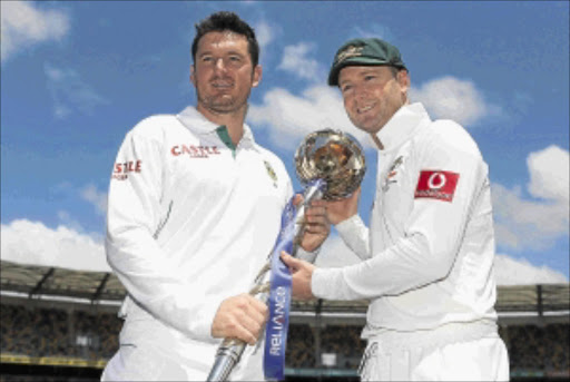 PRIZED: Michael Clarke of Australia, right, and Graeme Smith of SA pose with the ICC Test Championship mace at The Gabba yesterday. Photo: Getty Images