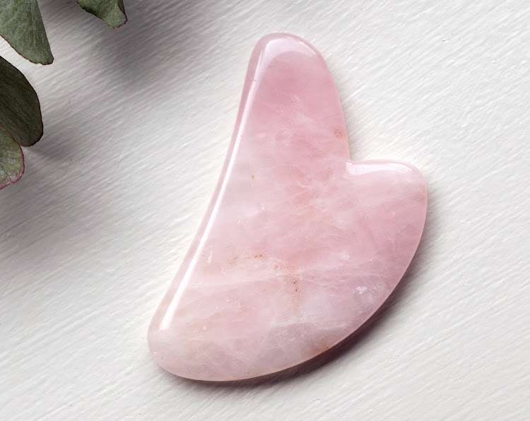 Gua sha stone in rose quartz.