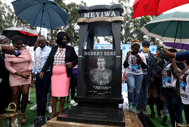 Senzo Meyiwa's mother Ntombifuthi next to his tombstone, which was unveiled at Mayville Heroes Acre in Durban on Tuesday.