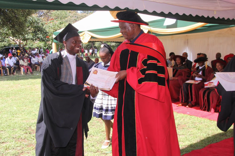 Attorney General Justin Muturi awarding a graduate during the ceremony at Kanyuambora in Embu on Friday 12, April 2024.