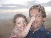 A portrait of the author as a young man posing with his daughter, Phoebe, during a seaside holiday.