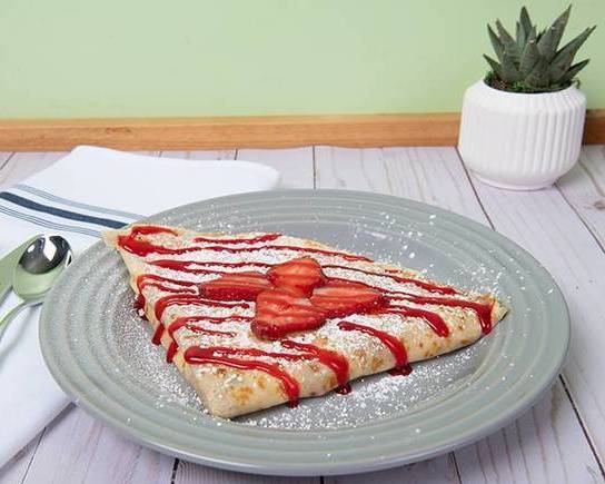 Strawberry Cream Crepe: A symphony of flavors featuring luscious strawberry jam, fresh strawberries, creamy cream cheese, delicate cream fraiche, a dusting of powdered sugar, and a drizzle of irresistible strawberry syrup. A sweet melody for your taste buds!