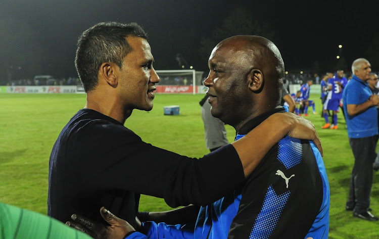 A file photo of Pitso Mosimane (R) embracing Fadlu Davids (L) after a PSL match.