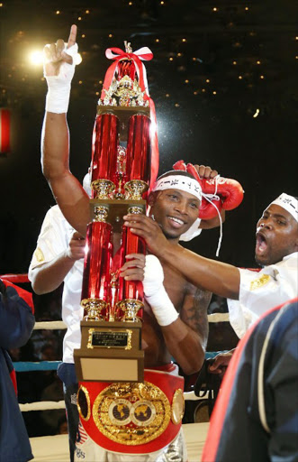 A file photo of South African boxer Zolani Tete celebrating his win over Japan's Teiru Kinoshita after their IBF super-flyweight title match in Kobe on July 18, 2014. South African Zolani Tete won the International Boxing Federation super-flyweight title by beating Teiru Kinoshita of Japan on a 3-0 decision in a battle of southpaws in Kobe.