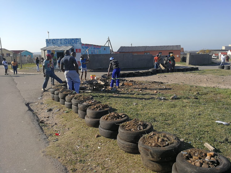New Brighton residents use old tyres to surround a dumping site and transform it into a park