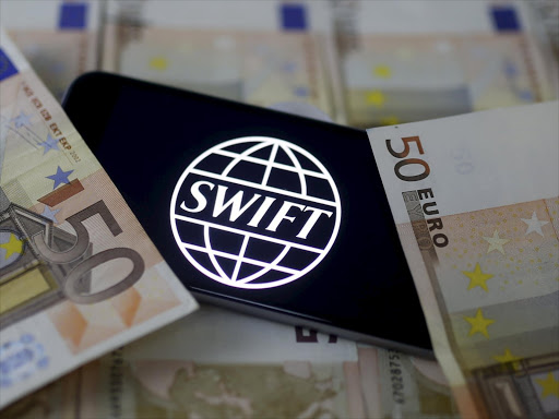 Swift code bank logo is displayed on an iPhone 6s on top of Euro banknotes in this picture illustration made in Zenica, Bosnia and Herzegovina, January 26, 2016. Photo/REUTERS