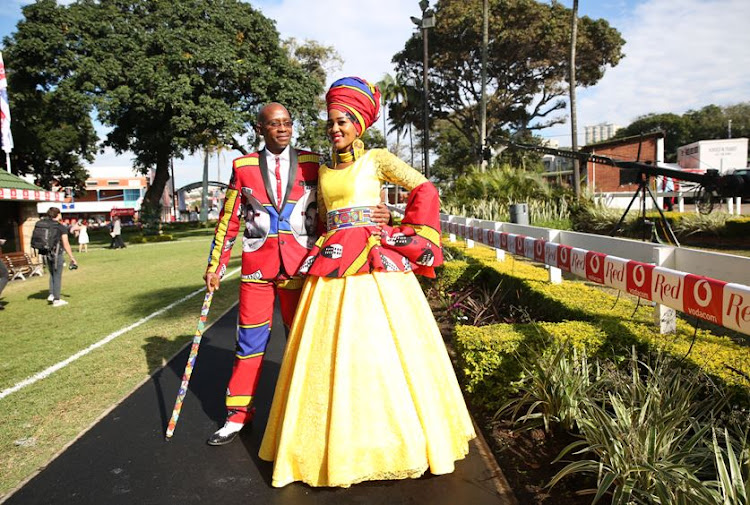 Musa And Lindo Mathebula wearing her own design at the Vodacom Durban July.