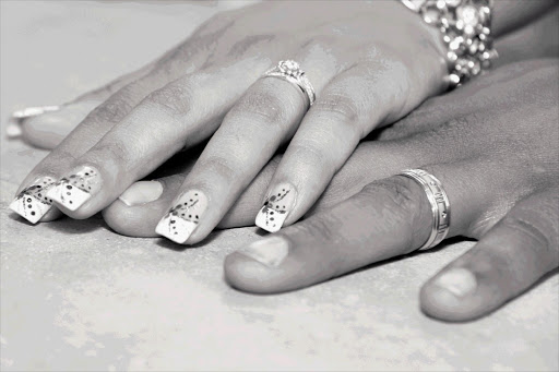 A couple with their wedding rings. File photo.