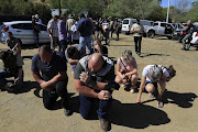A moment of prayer during the tension in the Free State town. 
