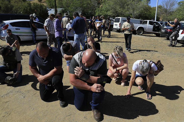 A moment of prayer during the tension in the Free State town.