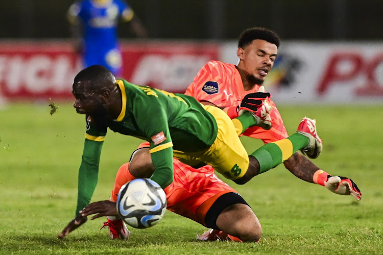 Ronwen Williams of Mamelodi Sundowns challenges Knox Mutizwa of Lamontville Golden Arrows in the DStv Premiership match at Mpumalanga Stadium in Hammarsdale, outside Durban, on Wednesday night.
