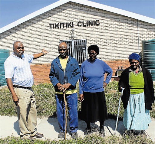 FED UP: Tikitiki village residents, from left, community leader Bless Rosi, Maza Phanda, Caroline Ngquba and Cecilia Njokweni still have to spend R36 to travel nearly 15km to get to the nearest hospital despite having this R12-million state-of-the-art clinic built by government in their village early last year Picture: SIKHO NTSHOBANE
