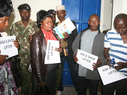 Members of the public and police officers arrest suspects nabbed shoplifting in Delamere Supermarkets, in Naivasha, along the Nairobi-Nakuru highway /GEORGE MURAGE