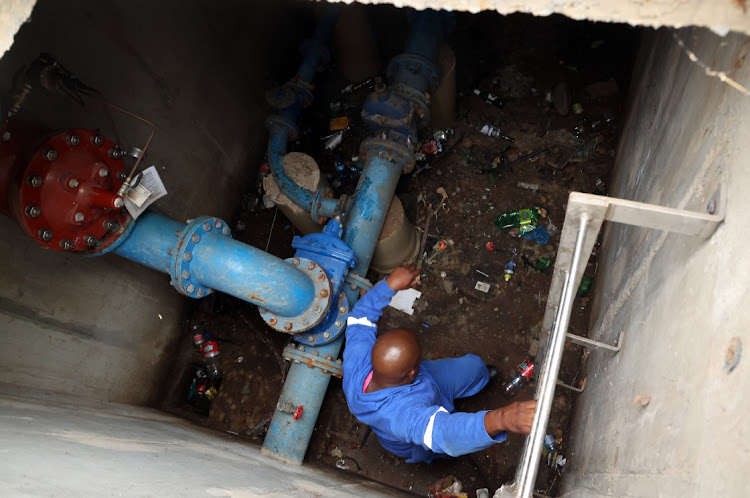 A Johannesburg water worker repairs water pipes in this file photo. Picture: ANTONIO MUCHAVE