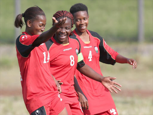 Esse Akida (14) Ann Onyango (8) and Mary Kinuthia (4) of Harambee Starlet at a past match. /PIC CENTRE