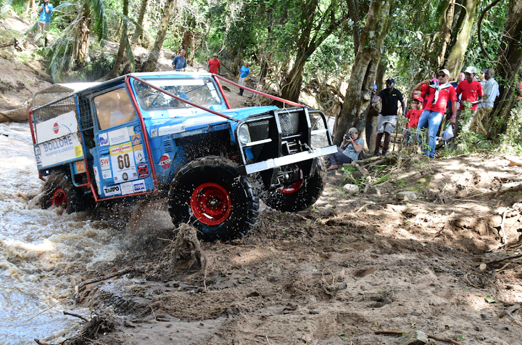 Car number 60 crosses a river during the 2018 Rhino Charge