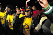 Supporters of expelled ANC Youth League president Julius Malema, some making the 'showerhead' gesture directed at President Jacob Zuma, at a night vigil for Malema in Polokwane last night.