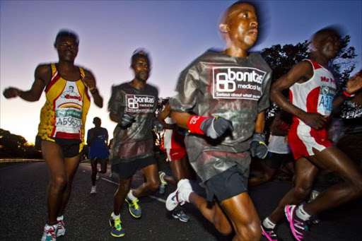 Runners during the 2011 Comrades Marathon from the City Hall in Durban to The Cricket Oval in Pietermaritzburg on May 29, 2011