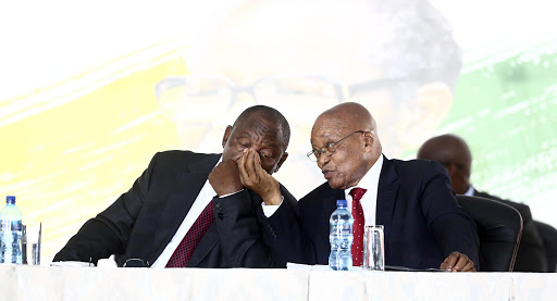 Jacob Zuma and Cyril Ramaphosa sat comfortably next to each other on the stage.