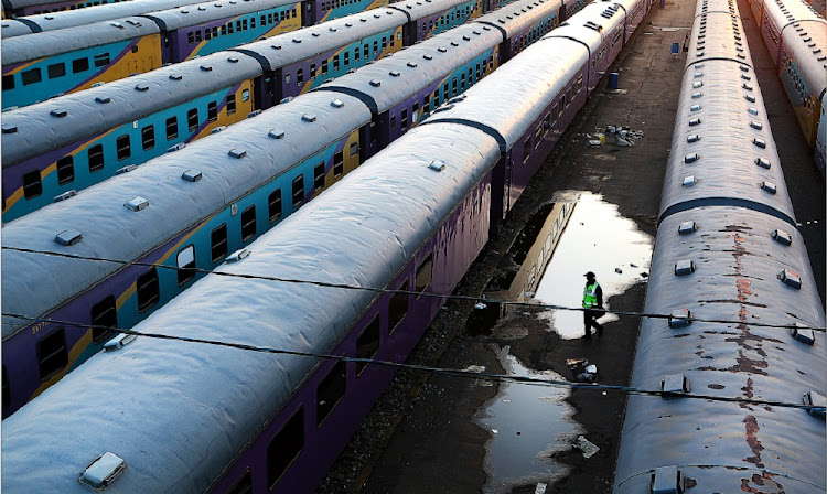 This picture is being used for illustrative purposes - A man inspects the Shosholoza Meyl trains, parked under The Nelson Mandela Bridge, in Johannesburg.