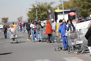 A large queue outside Makro, Alberton as the country moves to level 3 of the national lockdown.