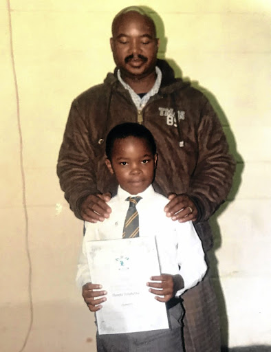 Luyanda Tshabalala standing with his father who fatally shot him outside his school in Ennerdale.