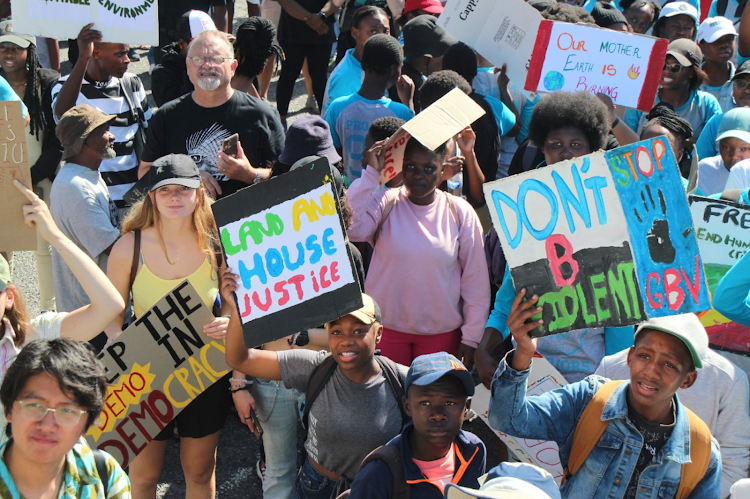 Hundreds of activists across generations marched together for climate justice