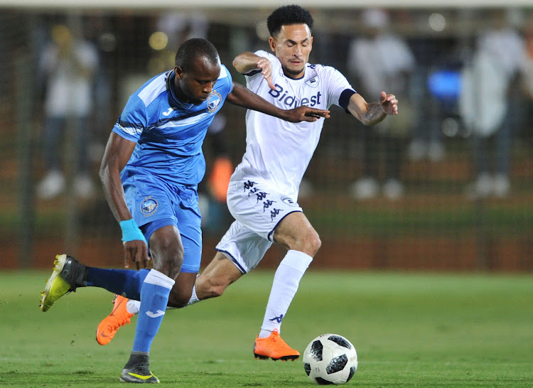 Augustine Tunde Oladepo of Enyimba challenges Daylon Claasen of Bidvest Wits during the CAF Confederation Cup match at Bidvest Stadium on Friday April 6 2018.