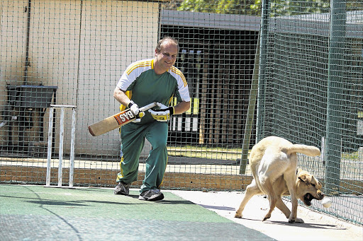 THE ZATOICHI OF CRICKET: Johan Schroeder's dog, Jaia, tries to steal the cricket ball during a practice session. Schroeder became the first person to score a century in a T20 cricket game for the blind