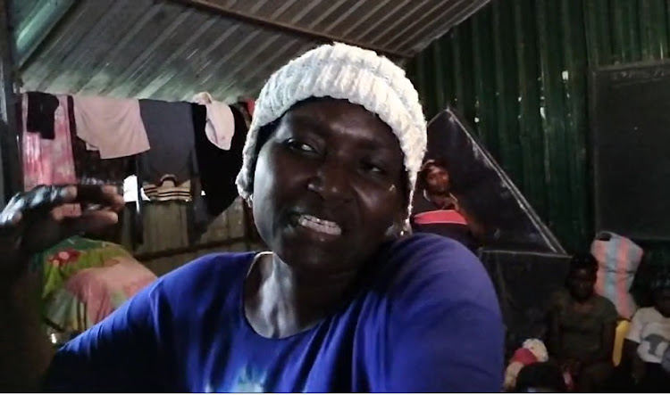 Rose Mueni gestures as she narrates how she struggled to save her two young children from drowning when floods hit Mathare informal settlement on Wednesday night, May 2, 2024.