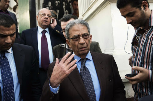 Egyptian National Salvation Front (NSF) leader, former presidential candidate and former Arab League secretary general, Amr Moussa, talks with journalists after attending a meeting with opposition leaders in Cairo on February 26, 2013. A