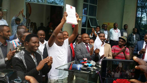 Politician Charles Njagua displays his nomination certificate for the Starehe MP seat at Jubilee Party headquarters in Nairobi, May 3, 2017. /COURTESY
