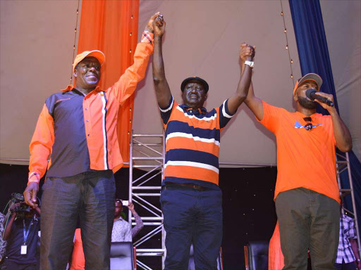 ODM leader Raila Odinga with his deputies Wycliffe Oparanya and Hassan Joho during the recent ODM 10 at 10 celebrations in Mombasa. /JOHN CHESOLI