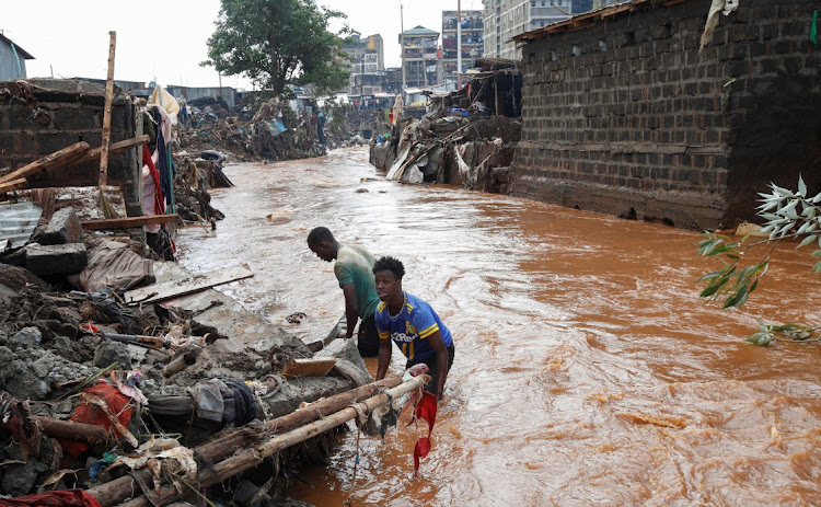 Residents sift through the rubble as they recover their belongings after the Nairobi River burst its banks and destroyed their homes within the Mathare Valley settlement in Nairobi, Kenya, on April 25 2024.