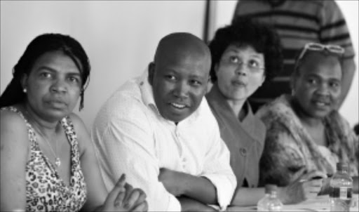 Dinah Pule, Deputy Minister of Communication, ANCYL leader Julius Malema, Minister of Agriculture, Forestry and Fisheries Tina Joemat-Pettersson and Sisisi Tolashe, Secretary of ANC Women's League at Luthuli House during the ANC - COSATU bilateral meeting. Pic: Elizabeth Sejake. 12/04/2010. © The Times JAW-JAW: Deputy Minister of Communication Dina Pule, ANC Youth League president Julius Malema and Minister of Agriculture, Forestry and Fisheries Tina Joemat-Pettersson at Luthuli House during the bilateral ANC-Cosatu meeting. Sowetan. 14/04/2010. Pg 05.