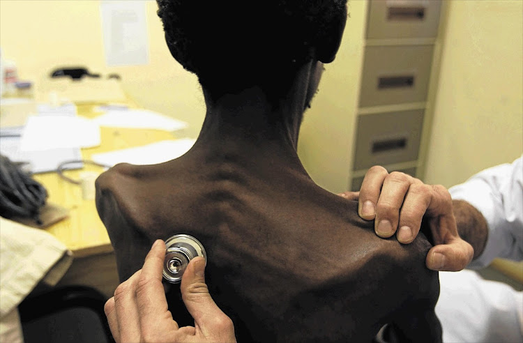 A TB sufferer is examined by a doctor. Academics have attributed 5.6 years of the life expectancy gap in HIV negative people to the higher TB mortality rate among men. File photo.