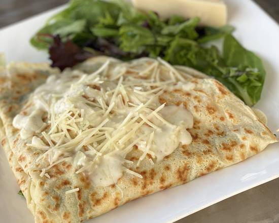 Chicken Parmesan Crepe: Savor a taste of Italy with tender chicken layered with the richness of melted mozzarella and grated Parmesan. Adorned with our homemade Alfredo and marinara sauces, sprinkled with basil and Italian spices, it's a delightful harmony of flavors that transports you to the heart of Italy