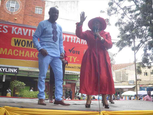 Agnes kavindu, Jubilee candidate for Machakos woman representative, with her son Moses Muthama during a rally at Mulu Mutisya grounds, June 12, 2017. /ANDREW MBUVA
