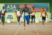 Akani Simbine anchors the mens 4x100m relay home during the ASA Speed Series 4 at Germiston Stadium on March 22, 2017 in Johannesburg, South Africa.