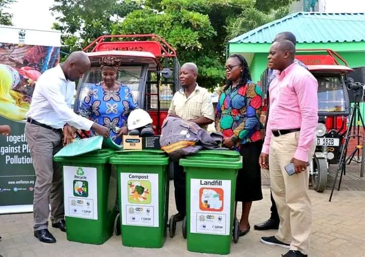Mombasa Deputy Governor Francis Thoya inspects some of the equipment donated for the bin system project aimed at improving efficiency in waste collection at households.
