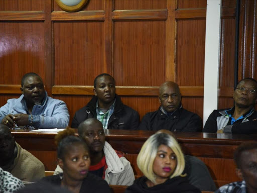 Some of the suspects in the Sh9 billion National Youth Service scandal, as pictured at Milimani Law Courts ahead of a pre-trial conference, June 6, 2018. /CAROLE MAINA